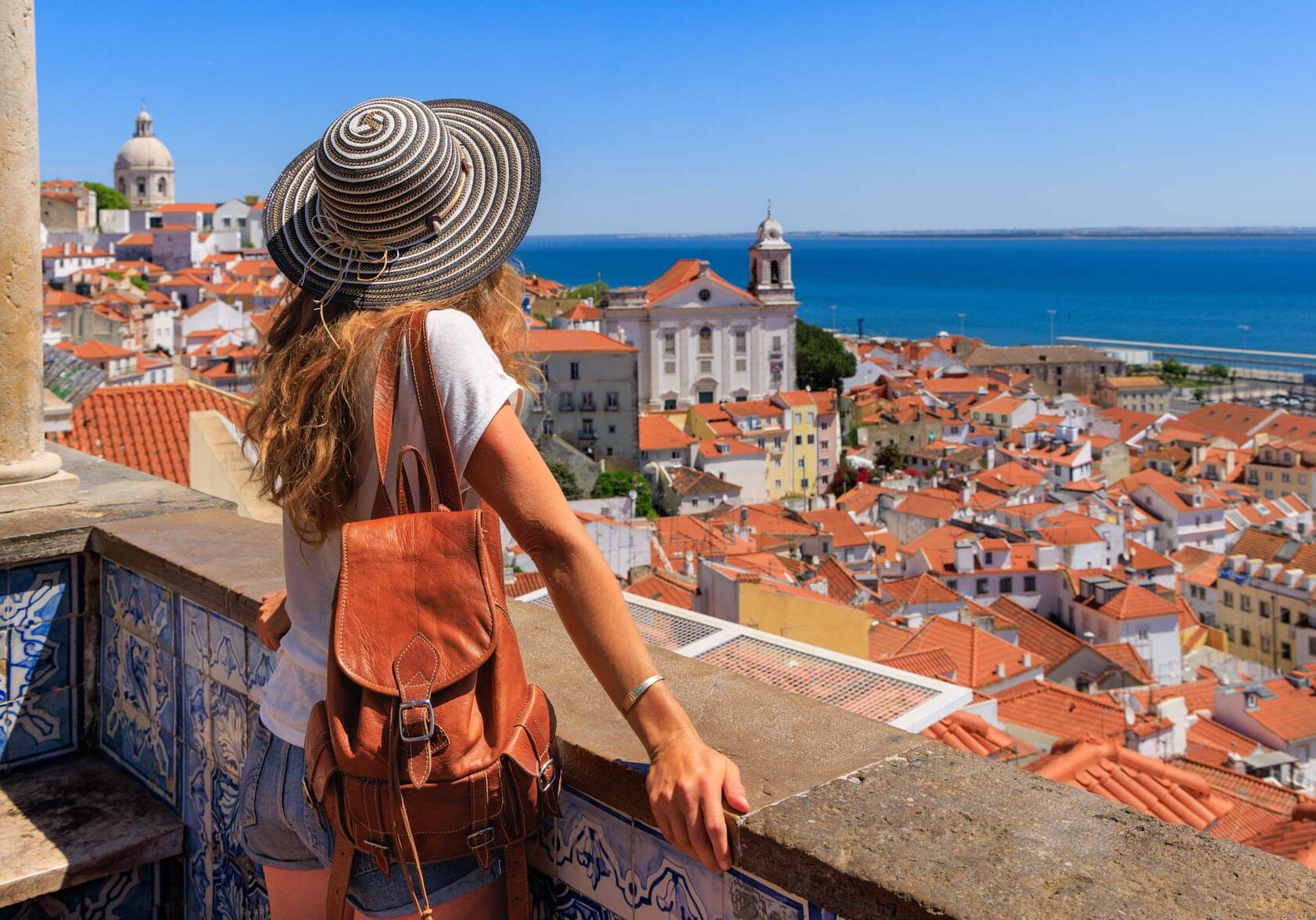 Woman tourist enjoying panoramic view of Lisbon city landscape- Portugal